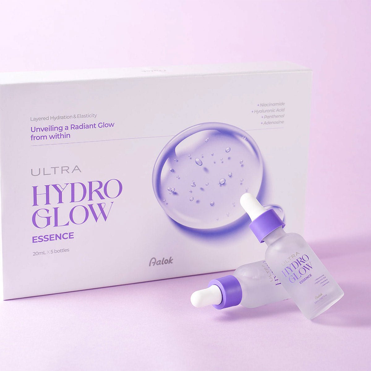Aalok Ultra Hydro Glow Essence packaging with dropper bottle on a pink background
