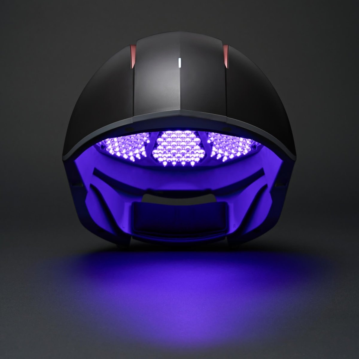 Aalok Hairbud with blue LED lights on a dark background