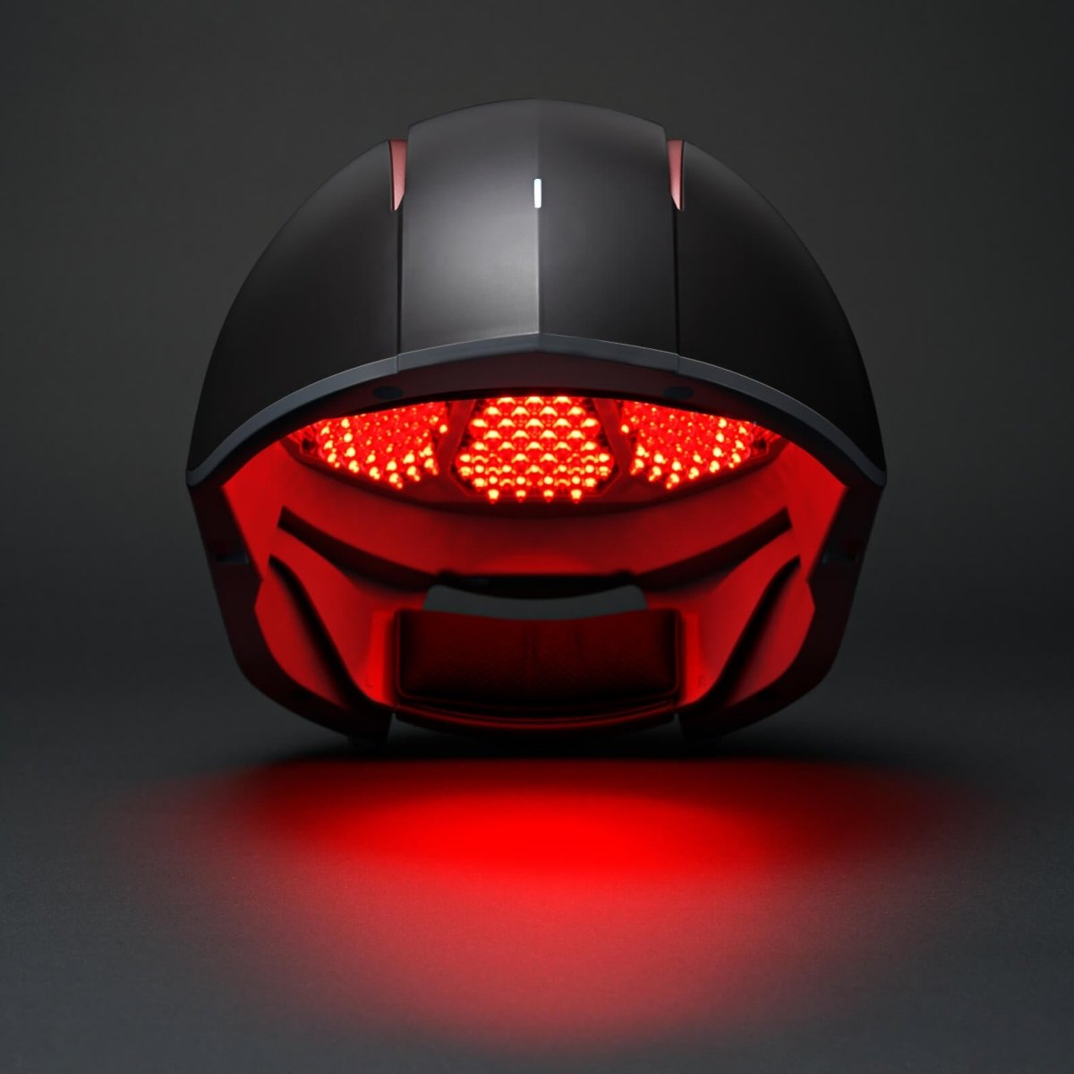 Aalok Hairbud with red LED lights on a dark background