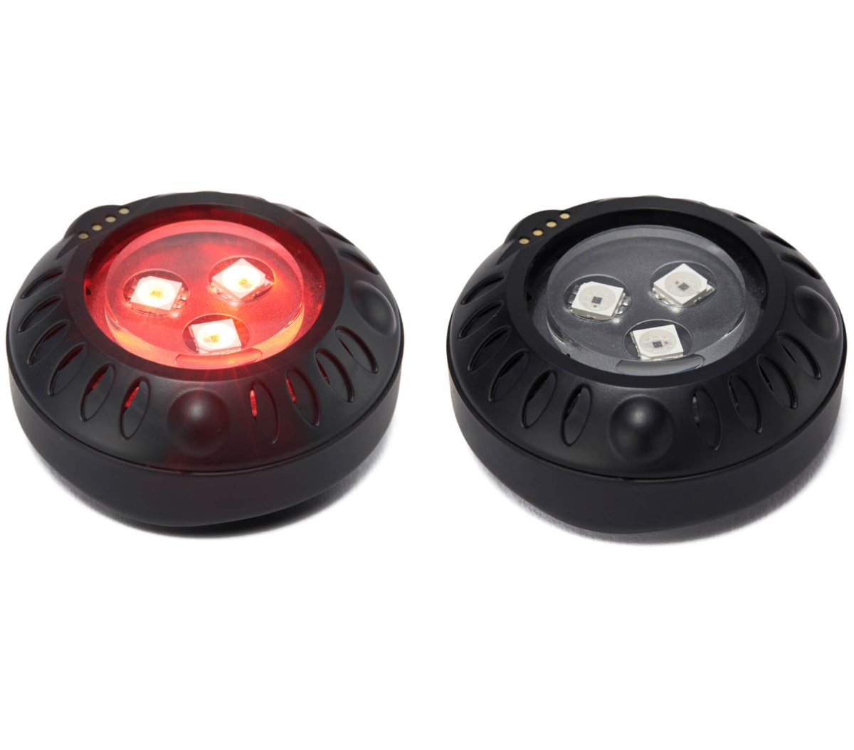 Two Aalok Patches, one red light and one off, on a white background